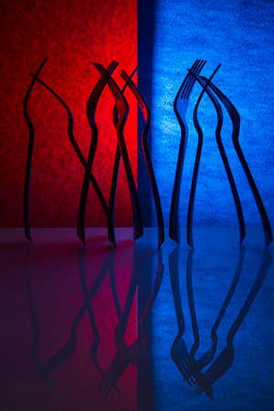 Abstract composition with forks on a colored backgroundの写真素材