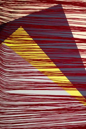 Abstract installation of red rope colored cardboard sheetsの写真素材