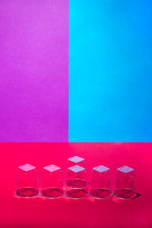 Still life with a figure from glasses on a colored backgroundの写真素材