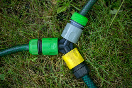 Triple connection system for watering hoses in grassの写真素材