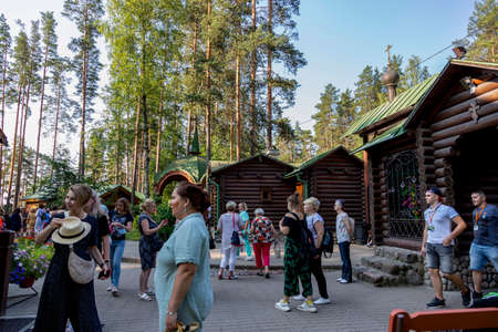 Sapyornoye, Russia - July 10, 2021: Tourists in the courtyard of the Temple of the Konevskaya Icon of the Mother of God in the village of Sapyornoye in the Leningrad regionのeditorial素材