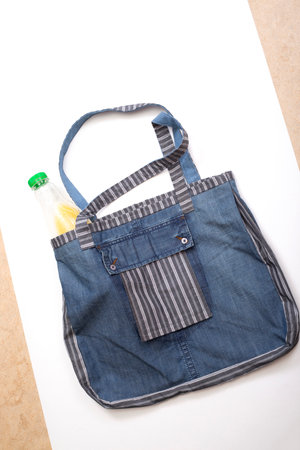 Reusable grocery Eco Bag made of natural fabrics on a white backgroundの写真素材