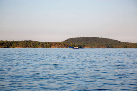 Landscape with a small ship at Lake Ladoga in the Republic of Karelia in Russia