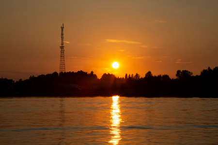 Sortavala, Russia - July 10, 2021: Sunset on the background of a television tower in Sortavala, Republic of Karelia in Russiaのeditorial素材