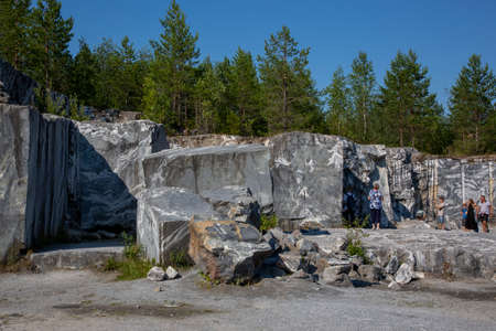 Ruskeala, Russia - July 10, 2021: People inspect the marble mining site in the Marble Canyon in Ruskeala in the Republic of Karelia in Russiaのeditorial素材