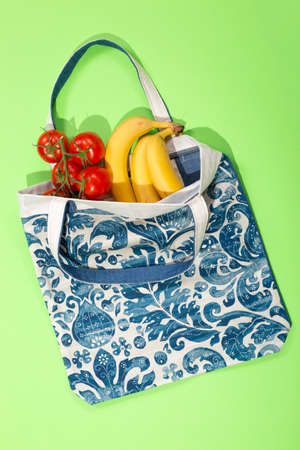 Reusable grocery Eco Bag made of natural fabrics on a white backgroundの写真素材