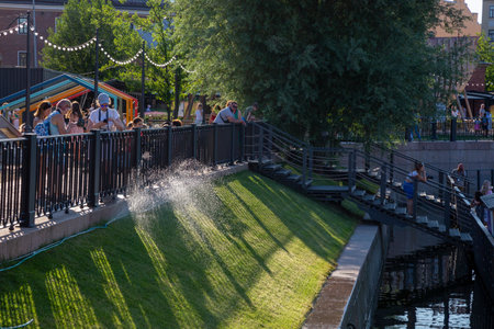 St. Petersburg, Russia - July 12, 2021: People relax in the territory of the city park "New Holland" in St. Petersburgのeditorial素材
