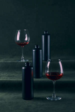 Still life with bottles and glasses with red wineの写真素材