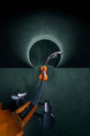 Abstract still life with a violin neck stretched out in spaceの写真素材
