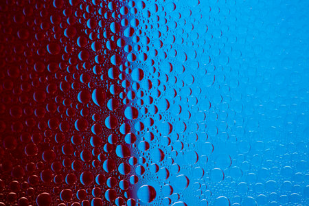 Abstract background of water droplets on the glass surfaceの写真素材
