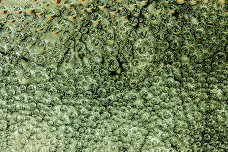 Abstract background of water droplets on the glass surface