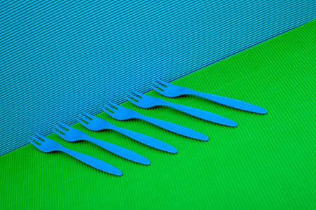 Abstract still life with blue forks on a colored backgroundの写真素材