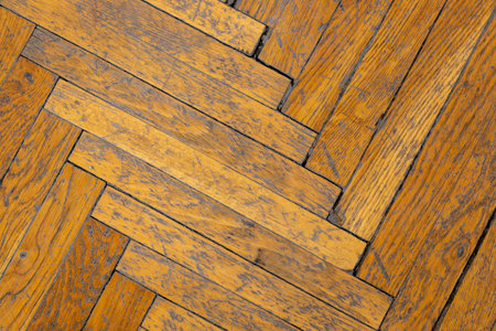 Background, texture of the surface of an old wooden parquetの写真素材