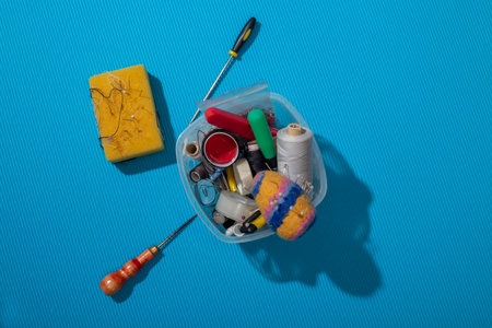 Box with sewing accessories and tools, top view