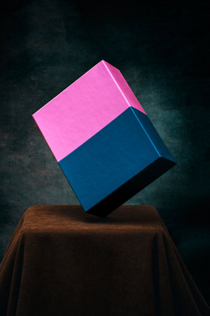 Still life with a blue-pink box on a brown table
