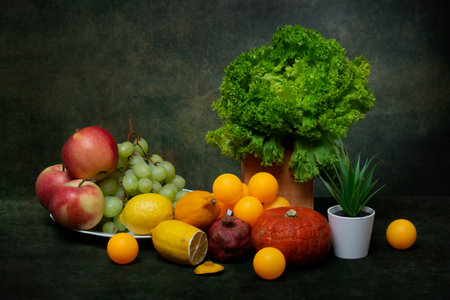 Still life with fruits and vegetables, plants and ballsの写真素材