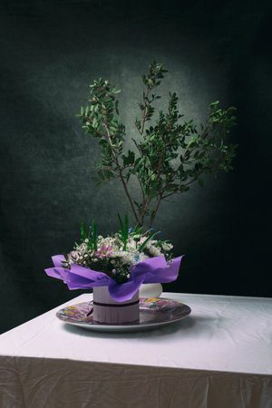 A beautiful bouquet of flowers on the table with a white tablecloth
