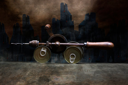 Still life with a hand drill and canned food against the backdrop of a futuristic city, stylizationの写真素材