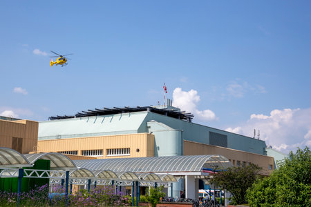 Vienna, Austria - June 14, 2023: An ambulance helicopter lands on the roof of the Donaustadt Clinic building in Viennaのeditorial素材