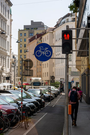 Vienna, Austria - June 22, 2023: Traffic lights and road signs regulating the movement of cyclists on the street in Viennaのeditorial素材