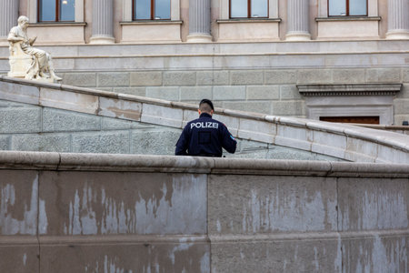 Vienna, Austria - February 15, 2024: A policeman in front of the Austrian Parliament building