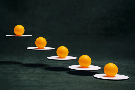 Still life with balls on white stands suspended in the air