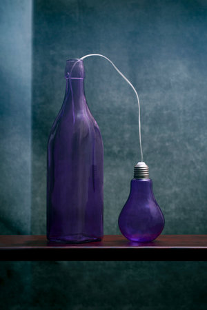 Still life with a purple bottle and a light bulb, stylization
