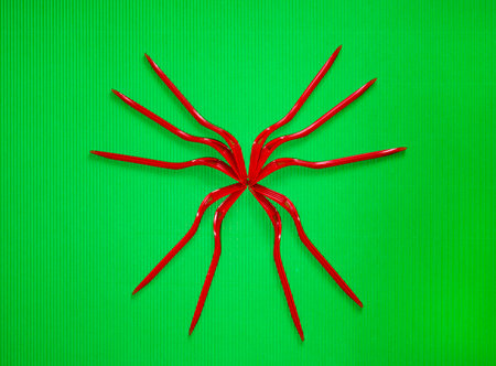 Figure of red forks on a green background