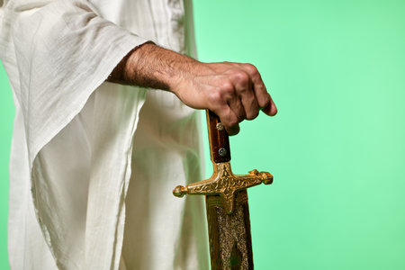Traditional Saudi out-feet on chromakey. Arabian long saber - saif.の写真素材