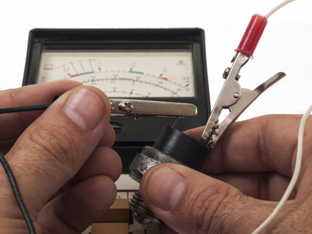 Checking the technical condition of the sensor with a digital testerの写真素材