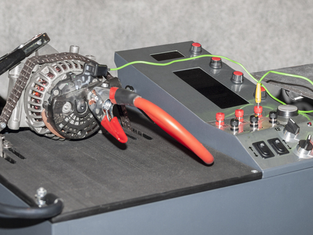 The stand for repair of the generator of the car