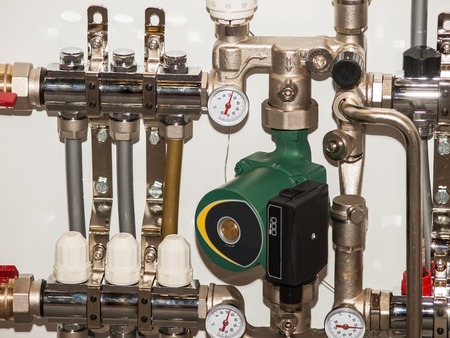 Water pump with taps and a check valve on the pipeの写真素材