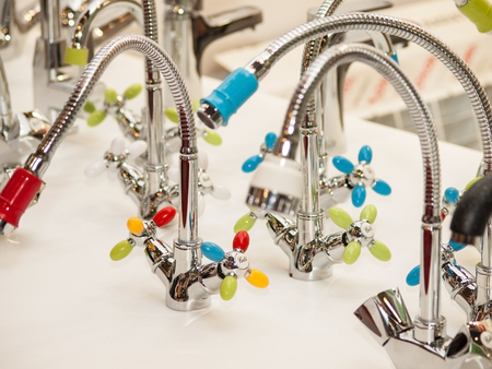 Mixer cold hot water. Modern faucet bathroom. Kitchen tap . Front view.