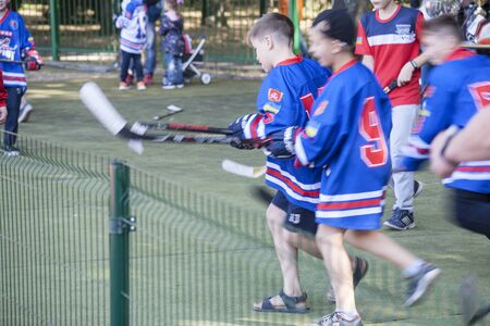 Vinnitsa, Ukraine - September 14, 2019: boys run with clubs for the ball on the cover. Motion blurのeditorial素材