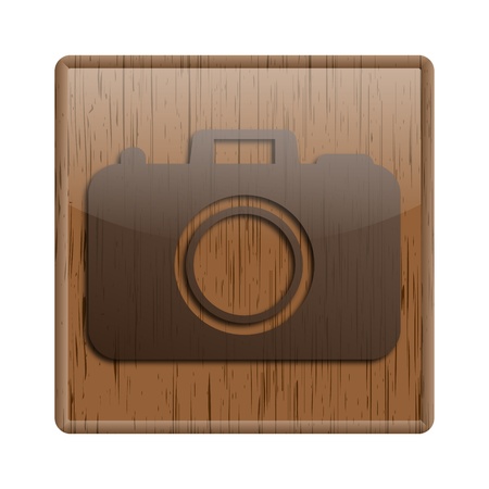 Shiny icon with brown design on wooden backgroundの写真素材