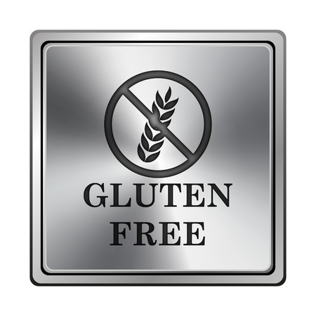 Square metallic icon with carved design on grey backgroundの写真素材