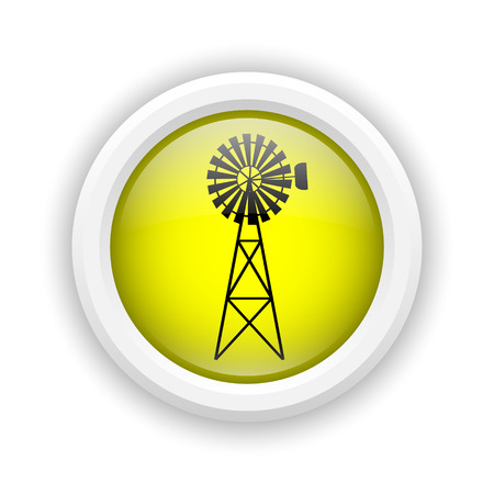 Round plastic icon with black design on yellow backgroundの写真素材