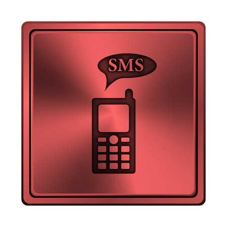 Square metallic icon with carved design on red backgroundの写真素材