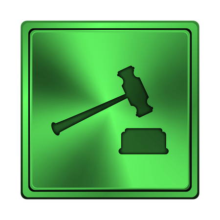 Square metallic icon with carved design on green の写真素材