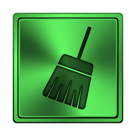Square metallic icon with carved design on green の写真素材
