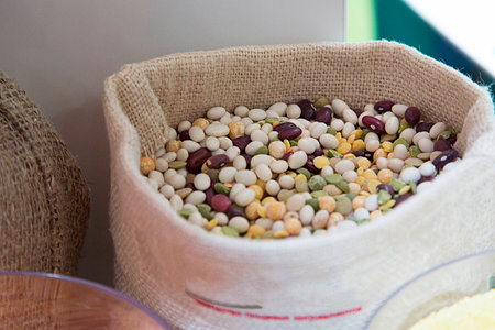 A mixture of beans in a canvas sack. Peas, beans, lentils, cornの写真素材