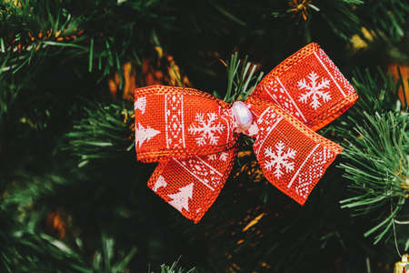 Christmas tree with red big bows with ornamentの写真素材