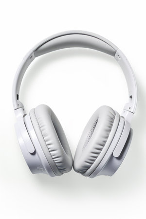 Pair of white headphones sitting on top of white table next to white wall. Generative AI.の素材