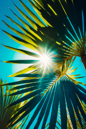 The sun shines brightly through palm tree's leaves on a sunny day. Generative AI.の素材