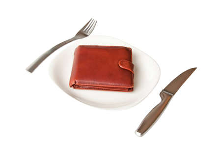 Isolated leather wallet on the white plate with fork and knife の写真素材