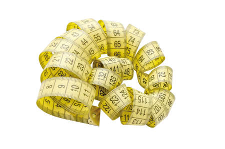 Twisted yellow tape measure isolatedの写真素材