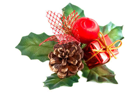 Christmas decoration with a pine-cone and green leaves isolatedの写真素材