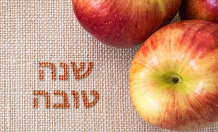 Jewish holiday of Rosh Hashanah, apples on canvas backgroundの写真素材