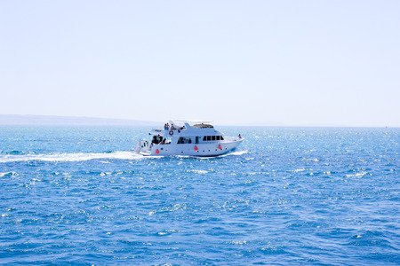 The Ship Sails on the Sea. Sea at Sun Light. Sea Water Backround.のeditorial素材