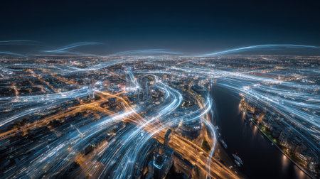 A panoramic, high-angle long-exposure night shot of a sprawling metropolitan area, transformed by blue and white light trails symbolizing data transmission and communication lines flowing through the city.の素材